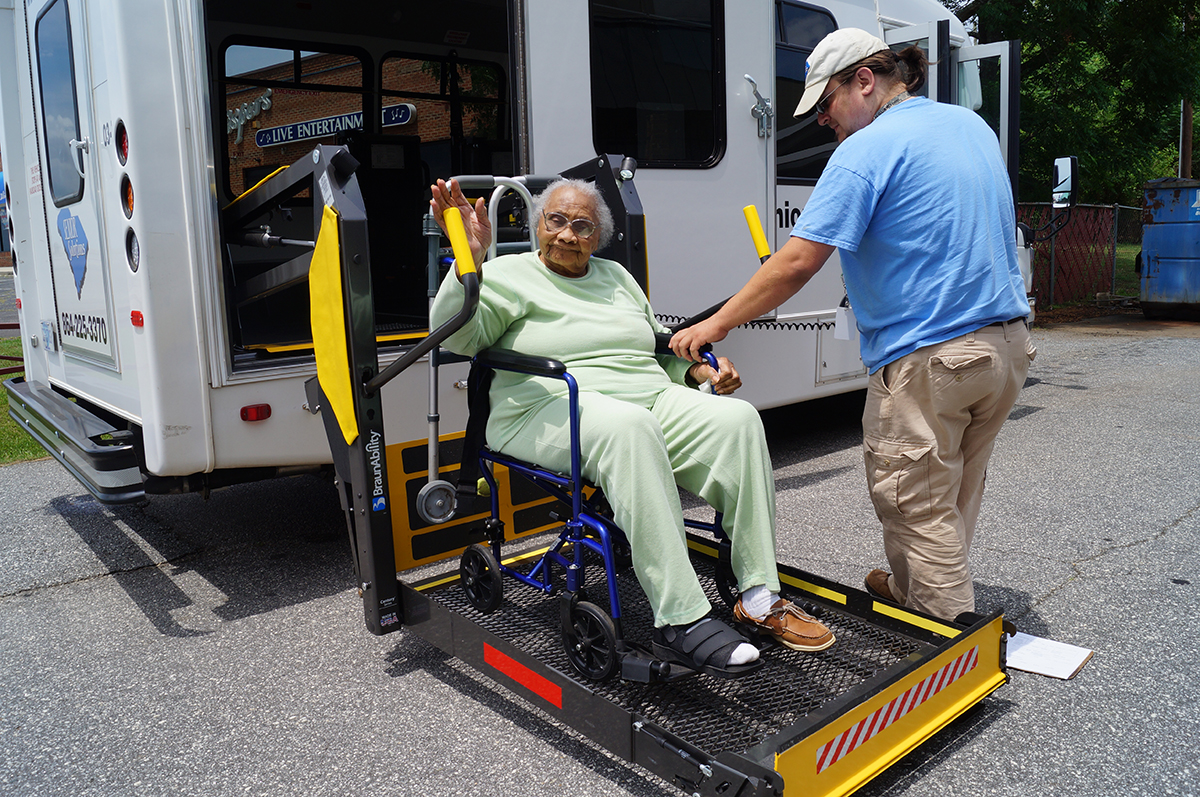 lady-being-lifted-in-bus lady-being-lifted-in-bus
